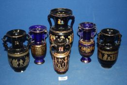 Six blue/black ground Vases with gold Greek designs,