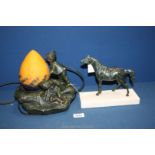 An Auguste Moreau style lamp with orange egg shaped shade featuring children playing on a rock,