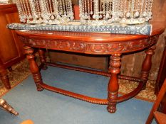 A Mahogany Side/Serving Table of "D" shape having a carved scroll decorated frieze and standing on