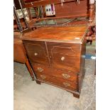 A Mahogany/Walnut commode type double doored Cupboard over two long drawers and raised on bracket