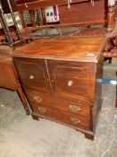 A Mahogany/Walnut commode type double doored Cupboard over two long drawers and raised on bracket