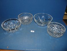 A quantity of cut glass trifle bowls including floral, dimple and other patterns.