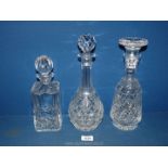 Three Decanters including square whisky marked Atlantis to base, wine decanter plus a footed one,