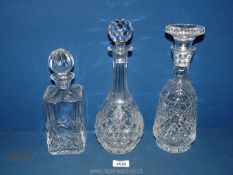 Three Decanters including square whisky marked Atlantis to base, wine decanter plus a footed one,