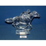 A Waterford crystal racehorse with jockey ornament.