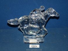A Waterford crystal racehorse with jockey ornament.