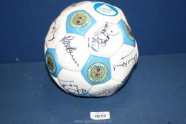 A Manchester City Football signed by many celebrities including Alex 'Hurricane' Higgins.