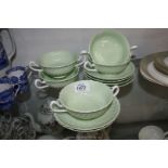 Five pale green and white Minton soup cups and six saucers.