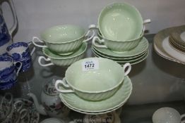 Five pale green and white Minton soup cups and six saucers.