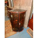 A cylinder fronted double doored dark lacquered wall hanging Corner Cupboard decorated with figures