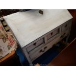 A painted shabby chic Oak bureau the slope opening to reveal an interior with waterfall pigeon