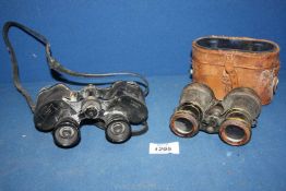 A part cased set of binoculars and a pair of Aitchison 8 x 32 Lumina (no. 16700) binoculars, a/f.