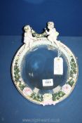 A Victorian continental cherub Mirror possibly German Sitzendorf/Dresden,