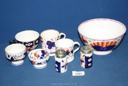 A quantity of Gaudy Welsh china including salt & pepper, two small mugs, cup, dish etc.