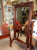 A substantial Mahogany framed Cheval/Robing Mirror supported on reeded pillars with Corinthian