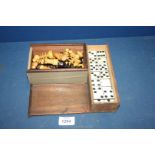 A wooden Chess set and Dominoes.
