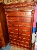 A Mahogany tall Chest of sixteen short Drawers with drop handles,