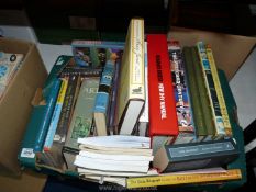 A box of books including Lord of The Rings and 'The Hobbit Companion Book',