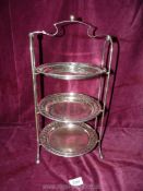 An Epns three tier Cakestand with pierced detail to edges, stand marked 'H W Ltd'.