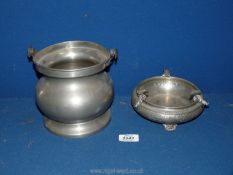 A pewter ashtray 6" wide x 2 1/2" deep and a pewter biscuit barrel 6" tall (no lid).