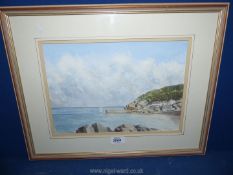 A framed and mounted Watercolour depicting a harbour scene with two sailing boats,