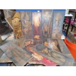 A quantity of paintings on wood depicting figures in various poses,