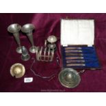 A box of silver plate items including toast rack, trophy, boxed knives etc.