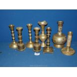 A small quantity of brass candlesticks and two engraved vases.