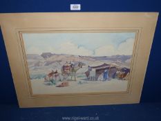 An unframed watercolour of bedouins and camels in the desert, signed H.