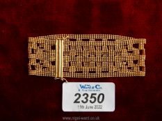 A 9 ct. gold Cuff bracelet, a wide beaded style with checkered effect, in red box.