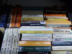 A box of paperback novels including Len Deighton, Owen Sela, Peter Viertel etc.