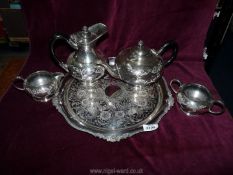 A four piece plated teaset by James Dixon and a heavy plated charger by Viners.