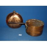 A copper hot water warming container, no stopper and heavy copper saucepan.