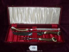 An antler handled Carving set by Cooper Bros. in red lined case.