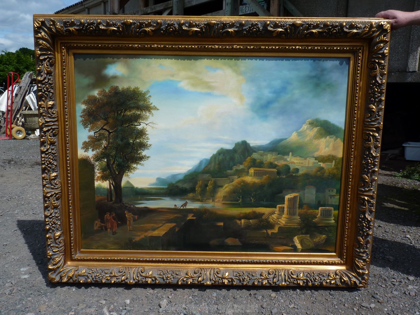 A contemporary Oil on canvas of a landscape with ruins in the foreground being a reproduction of