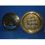 A brass convex porthole mirror, 15'' diameter and a brass wall plaque of a galleon,