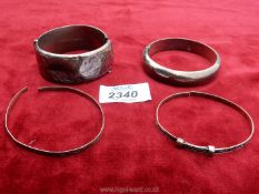 Four silver Bangles including one by Bracelon Ltd with leaf engraving, clasp damage and some dents,