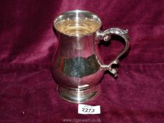 A Silver Tankard, Sheffield 1958, maker Walker & Hall, with leaf design to the handle, 5 3/4'' tall,
