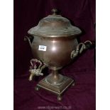 A copper and brass urn shaped Samovar