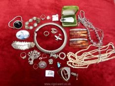 A wooden box of jewellery including a 1944 silver coin bracelet, Japanese bracelet, Delft brooch,,