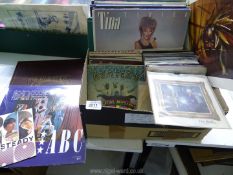 A box of 1960's and later vinyl 33 and 45 rpm records: Genesis, The Who, Beatles etc.