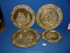 Three wall hanging brass chargers with tavern and ship scenes plus a smaller octagonal wall hanging