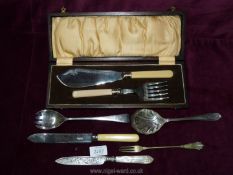 A small quantity of cutlery including wooden cased fish servers, silver knife,