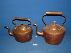Two copper kettles, some dents.