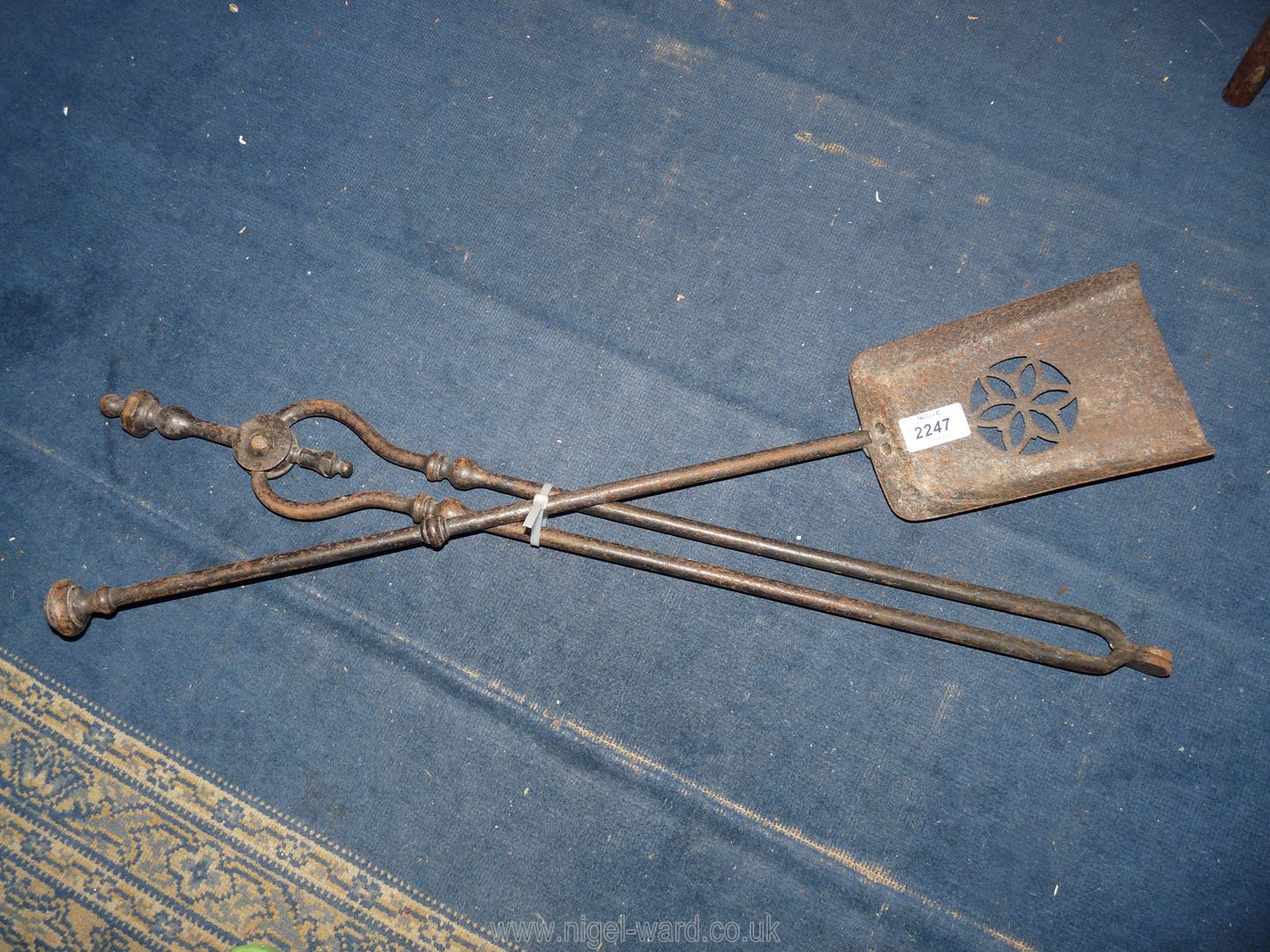 A coal tongs and shovel.