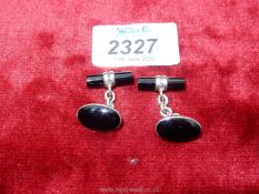 A pair of silver and onyx Cufflinks,