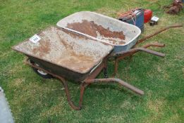 Two wheelbarrows.