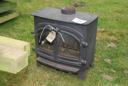 An oil-fired wood-burner style stove.