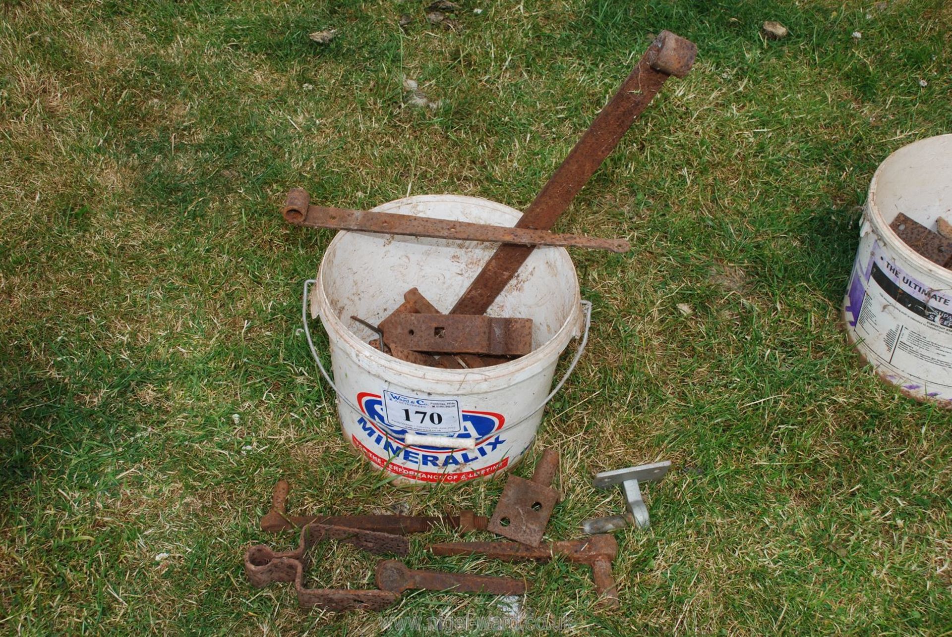 A bucket of gate fixings.