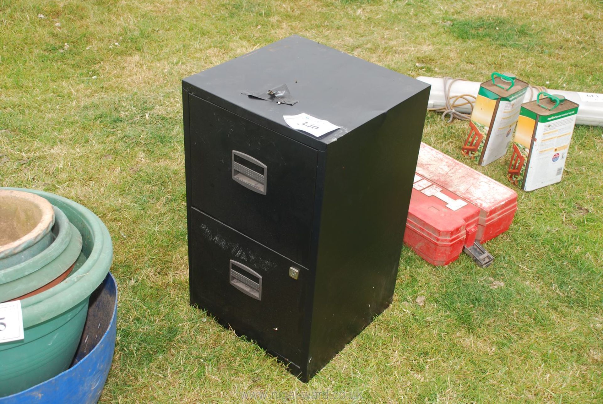 A 2 drawer metal filing cabinet.